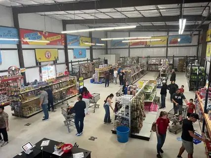 Shoppers browsing the aisles of an Alamo Fireworks store
