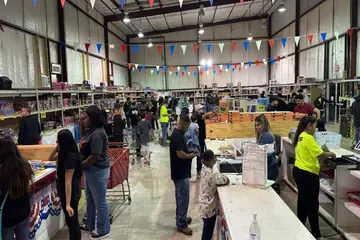 Busy Alamo Fireworks store decorated with red, white and blue bunting