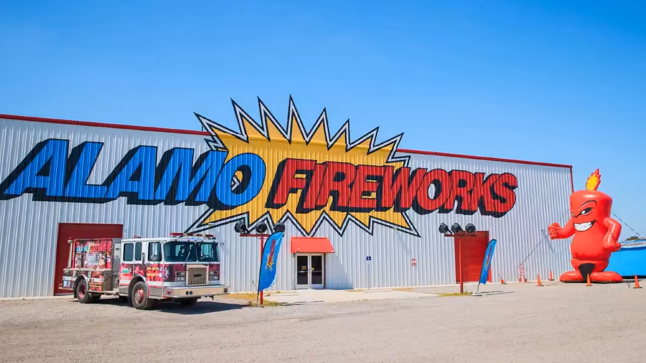 Alamo Fireworks megastore with a fire truck and the Burst mascot out front