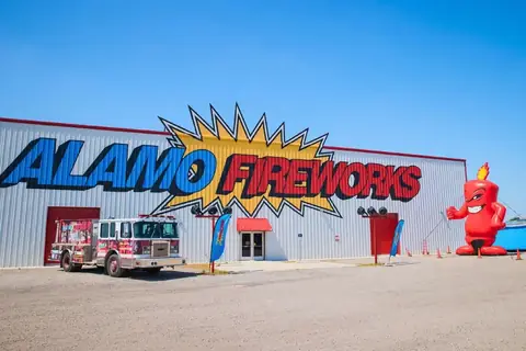 Alamo Fireworks megastore with a fire truck and the Burst mascot out front